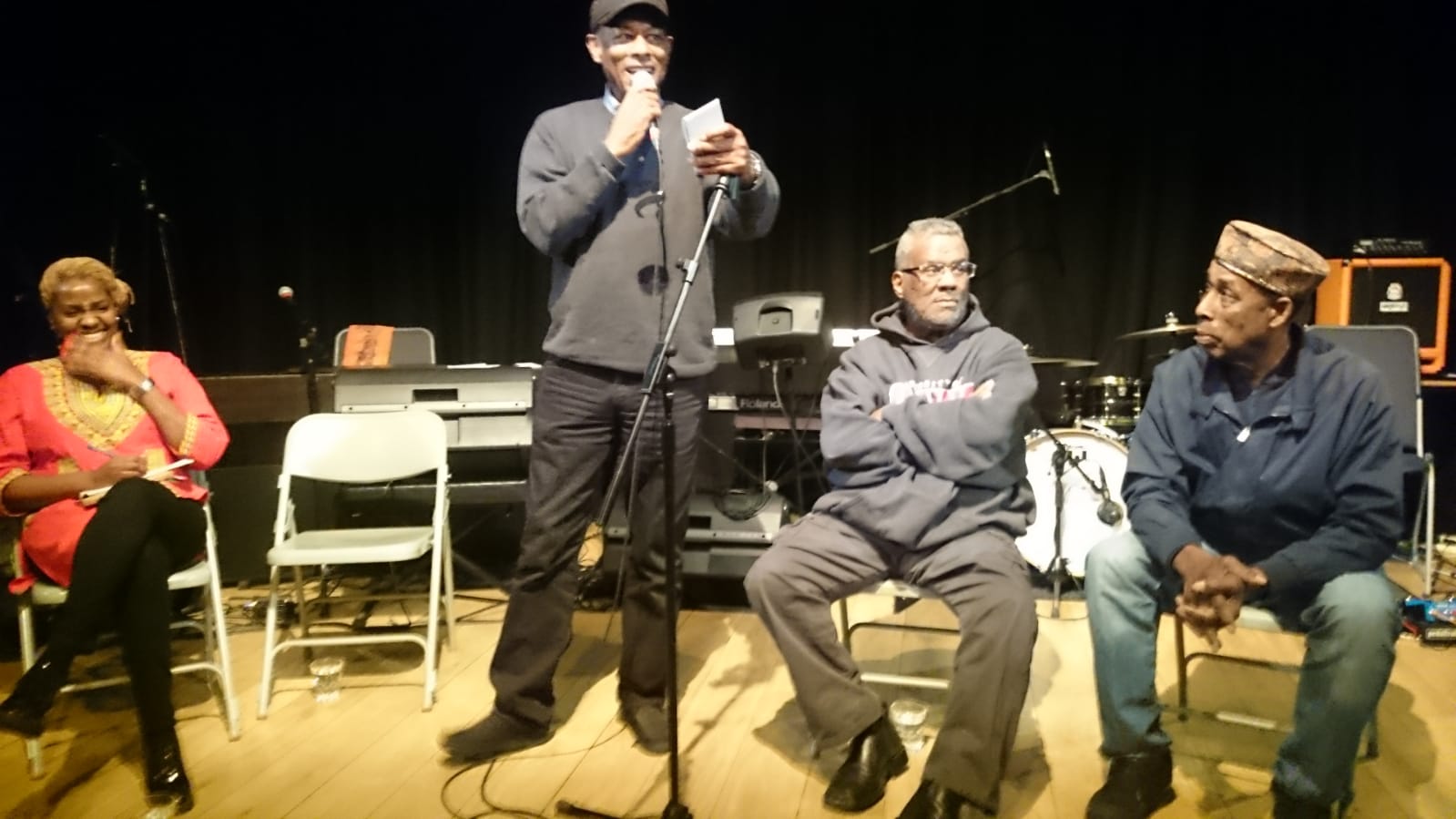 Speaker addressing the audience on stage