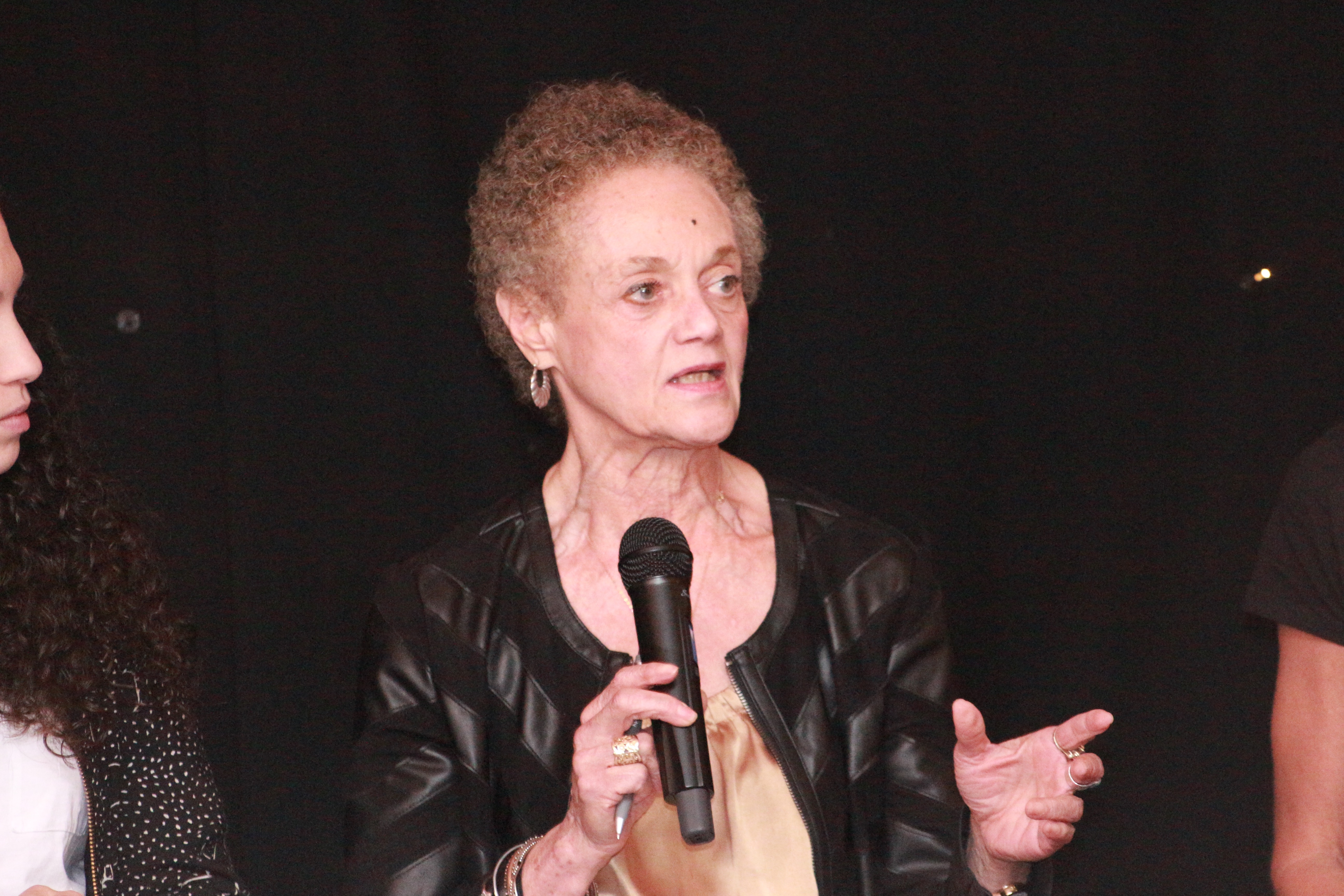 Woman speaking at a panel event
