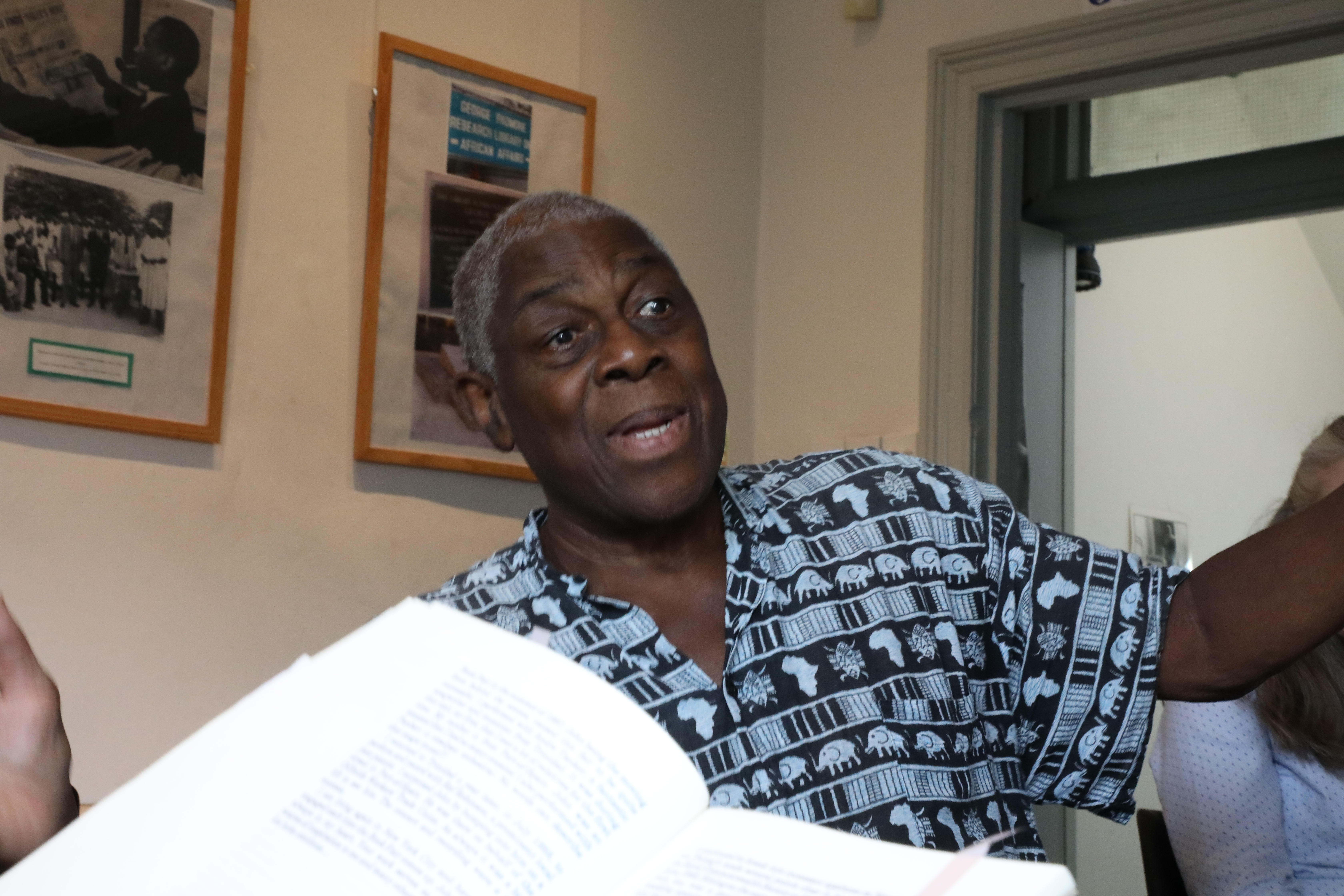Elder reading from a book